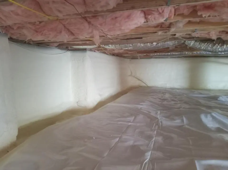 Crawl space encapsulation with closed-cell spray foam for Commercial Roof Restoration in Solon
